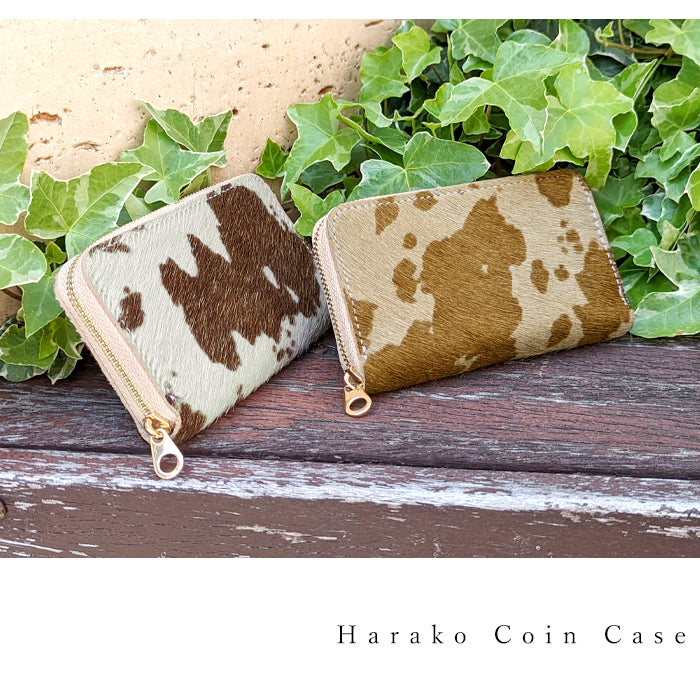 【財布の百貨店公式】 美しい毛並みとやわらかな手触りのコインケース 大人のハラコ風 本革 ラウンドファスナー コンパクト 小物入れ 牛革 小銭入れ うし柄 牛柄 【安心の返品保証付き】